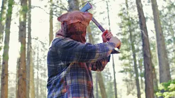 A Man in the Woods with an Axe