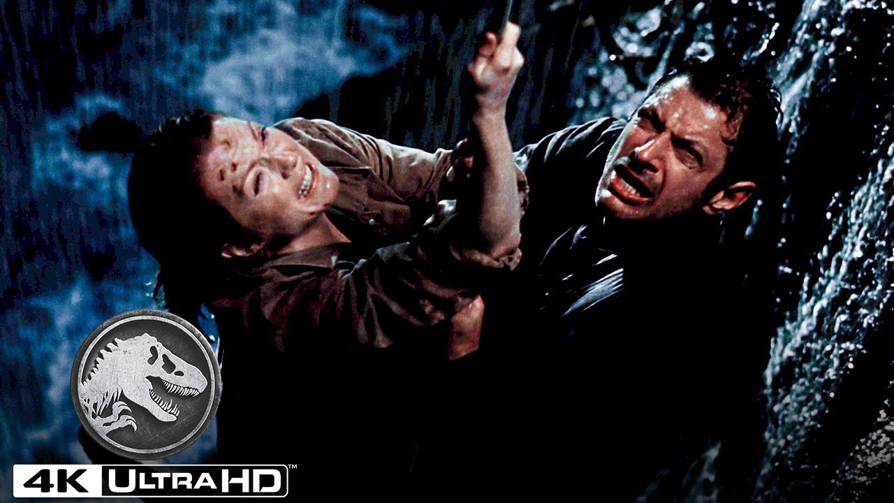 Wideo do filmu Park Jurajski: Zaginiony Świat — A Family of T. Rexes Pushes Ian Malcolm Off of a Cliff
